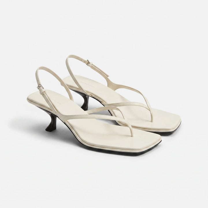 Stylish women's retro square toe sandals featuring a subtle kitten heel and adjustable slingback design.