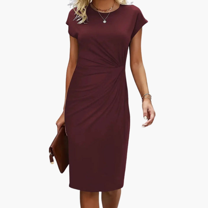 Versatile women's midi dress in a classic style with round neck and short sleeves, ideal for comfortable daily wear.