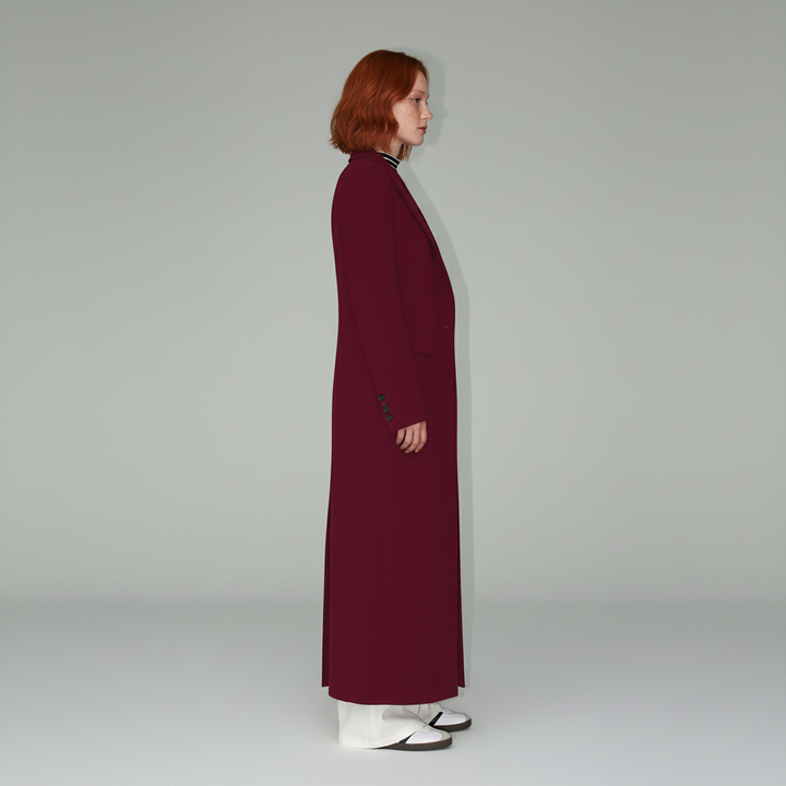 Fashionable women's ruby long fitted coat, an elegant tailored outerwear essential for both city and evening wear.
