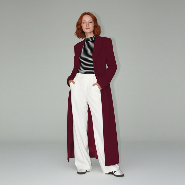Chic women's ruby long fitted coat, a tailored professional outerwear option creating a sleek and sophisticated silhouette.