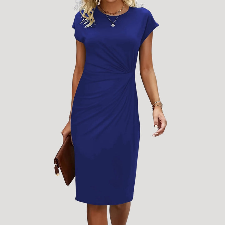 Stylish women's midi dress with cap sleeves, ruched details, and a sophisticated round neck. Fitted for elegance.