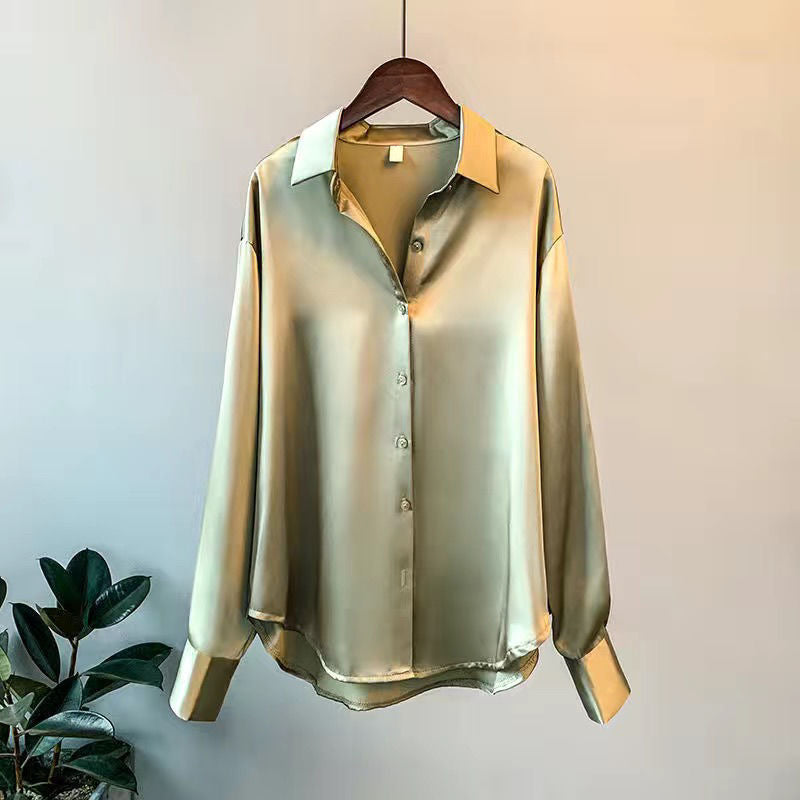 Fashionable women's blouse with elegant ruffles and long sleeves, a chic and versatile top.