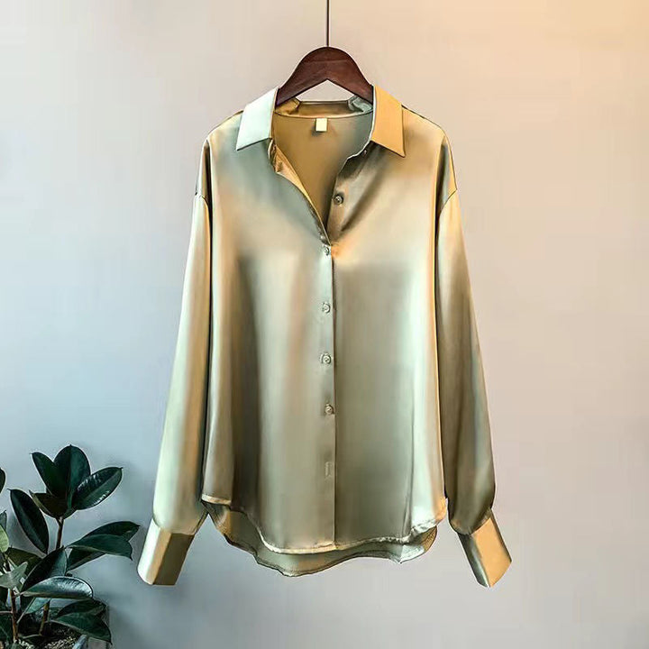 Fashionable women's blouse with elegant ruffles and long sleeves, a chic and versatile top.