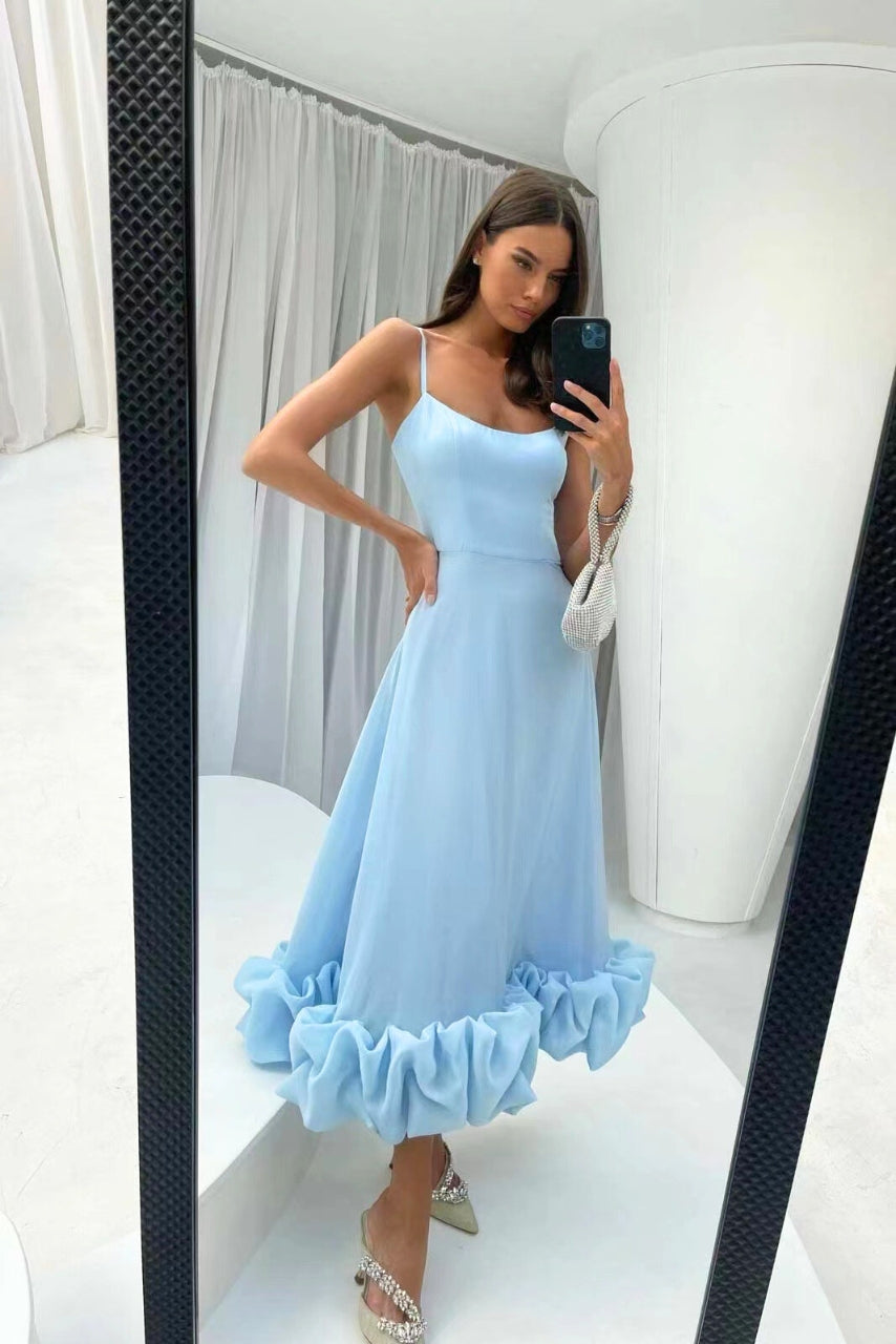Beautiful women's elegant formal maxi dress with a sophisticated ruffle hem. Ideal for special occasions.