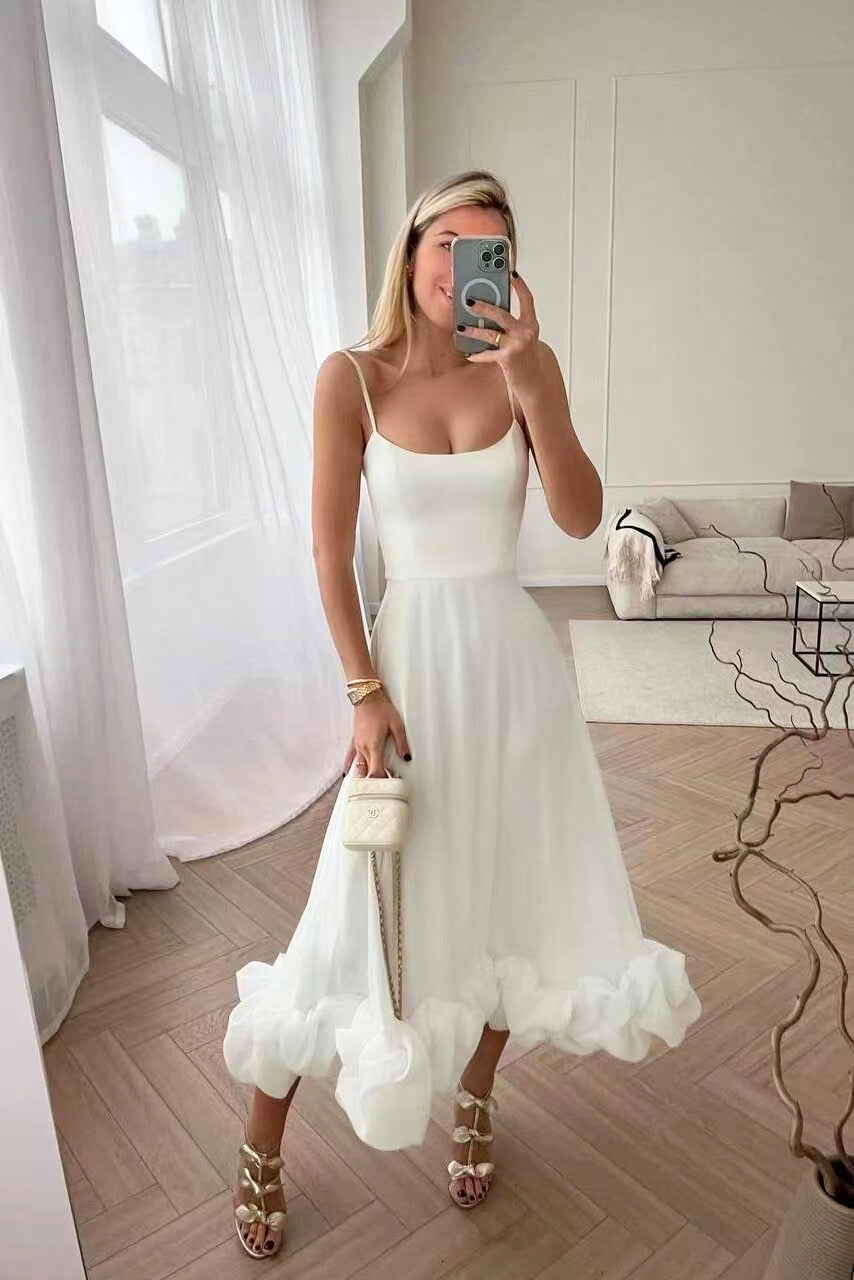 Flowing elegant maxi dress, ruffle hem, ideal for wedding guests & special occasions. Women's formal wear.