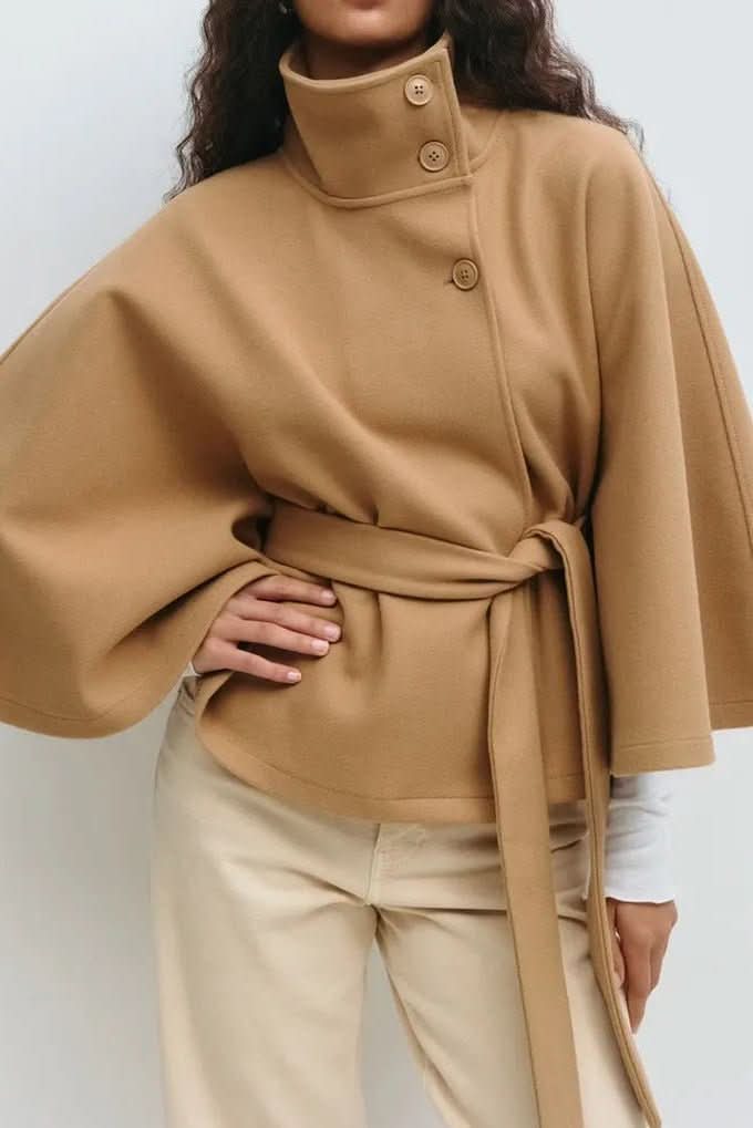 Versatile women's oversized cape with self-tie closure. Modern outerwear for elegant fall fashion and comfort.