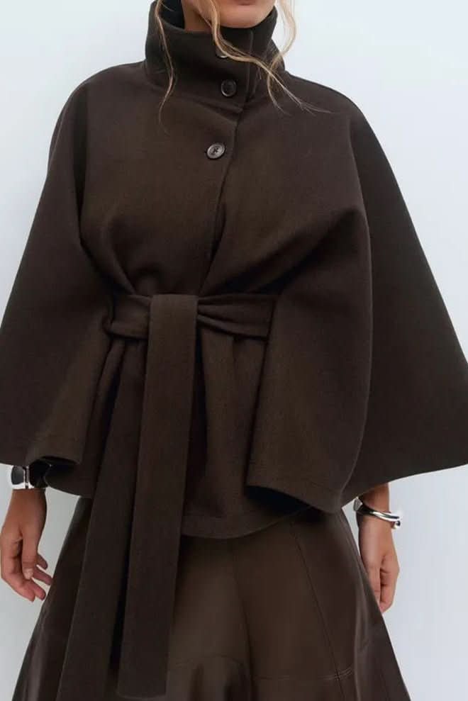 Modern women's cape with a self-tie closure and oversized fit. Elevate your fall/winter outerwear with chic style.