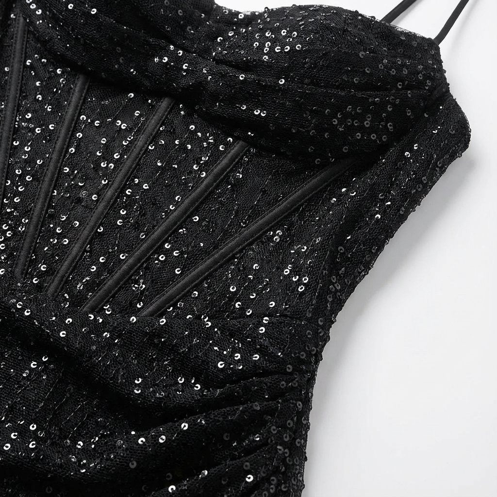 Women's shimmering sequin maxi dress, elegant strapless design, sweetheart neckline, and daring high slit.