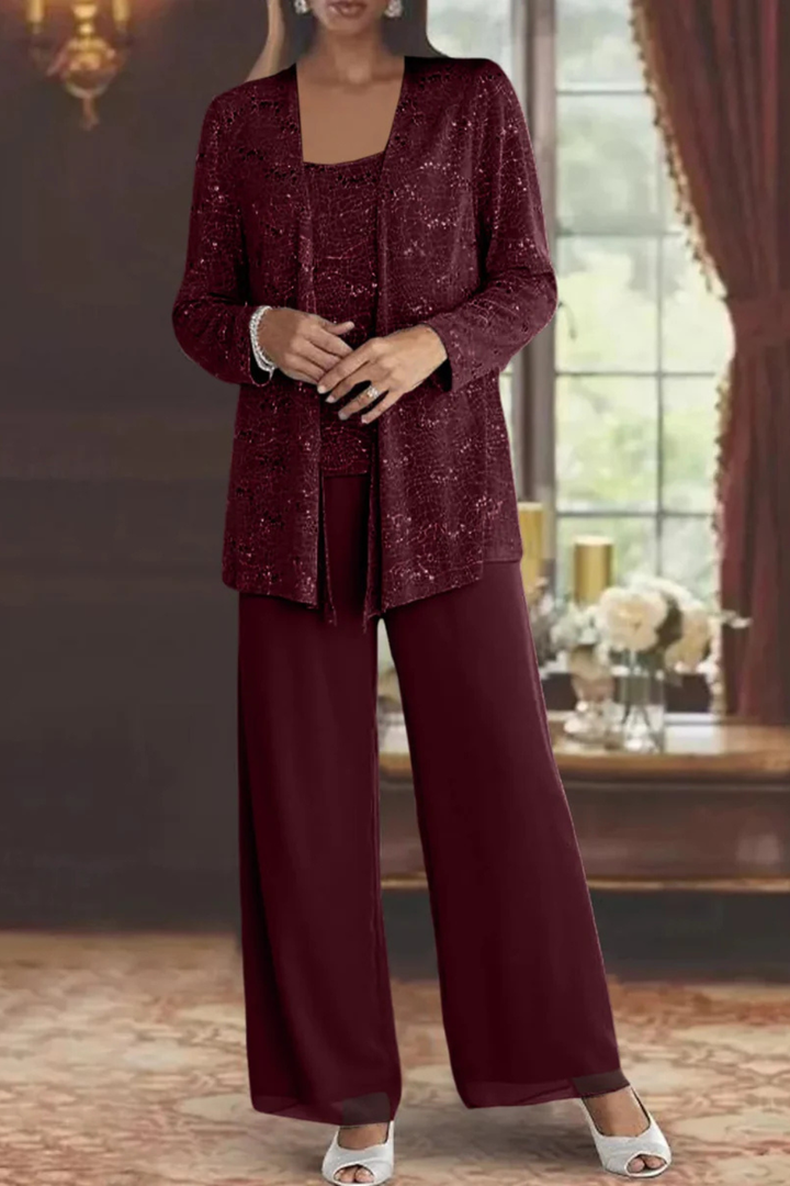Luxurious women's sequin three-piece pant set on hanger. Features wide-leg pants, top, and elegant cardigan.