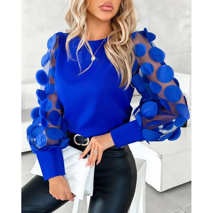 Fashionable women's long sleeve blouse with sheer appliqué sleeves & stylish button cuffs. Black, blue, red options.