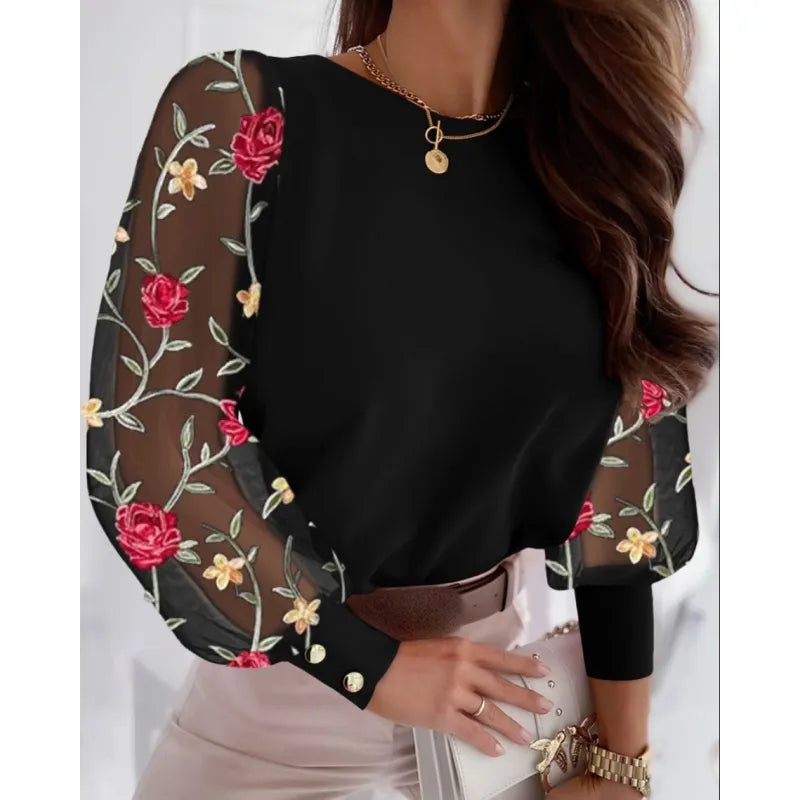 Beautiful women's sheer appliqué long sleeve blouse. Elegant round neck top for a stylish & sophisticated look.