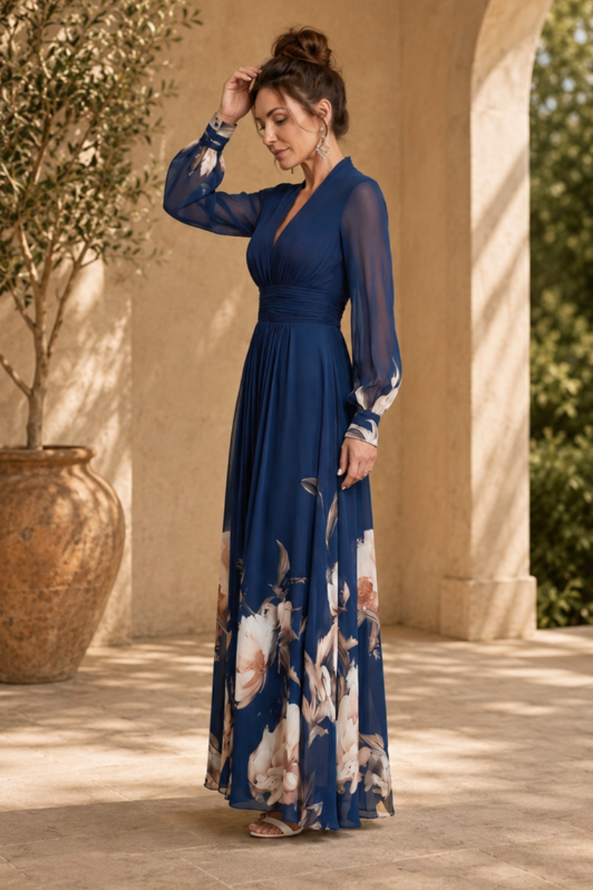Sophisticated pleated maxi dress with sheer sleeves for women. Ideal elegant party dress or formal occasion wear.