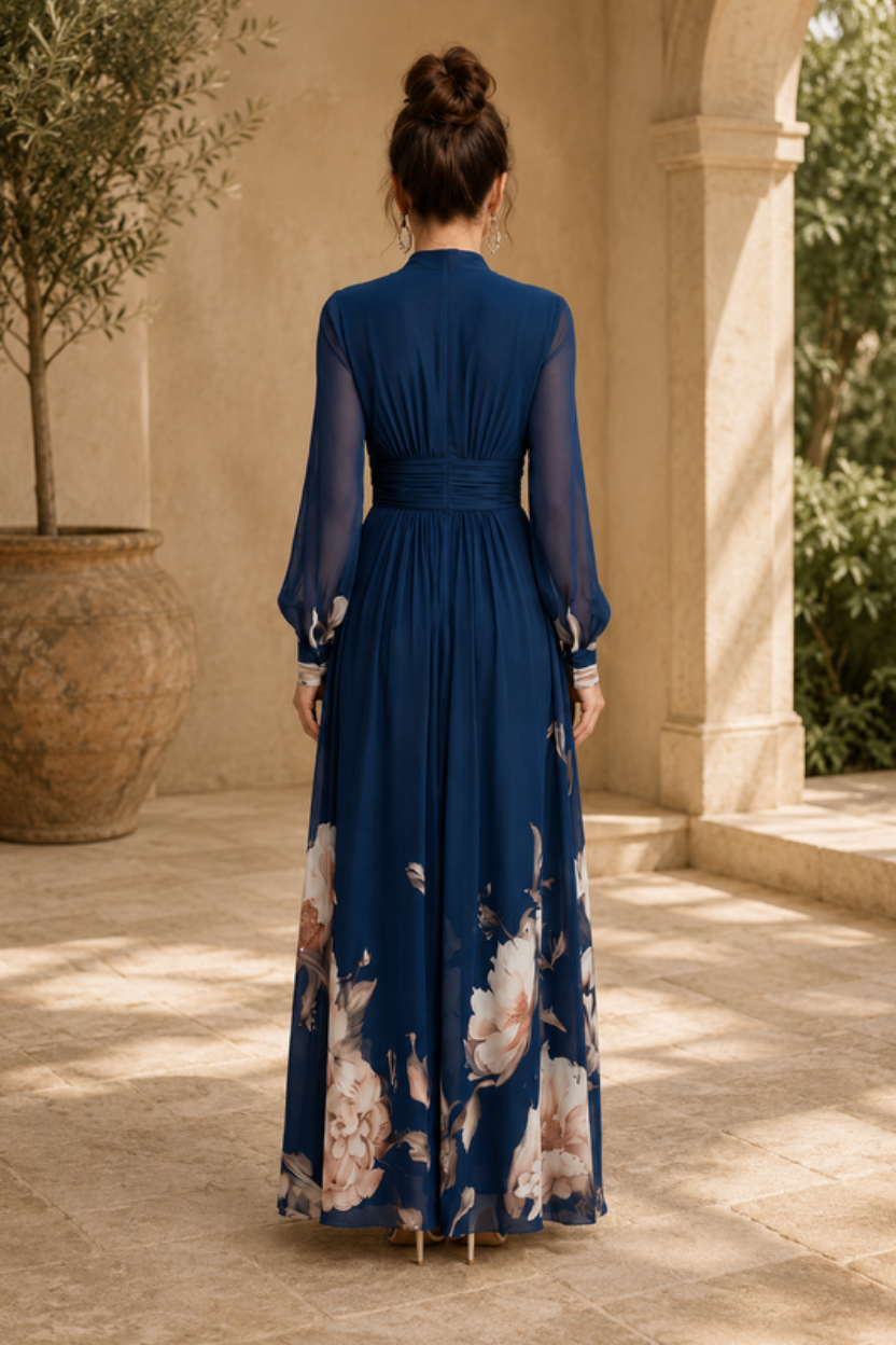 Long pleated evening gown for women, featuring elegant sheer sleeves. A sophisticated maxi dress for special occasions.