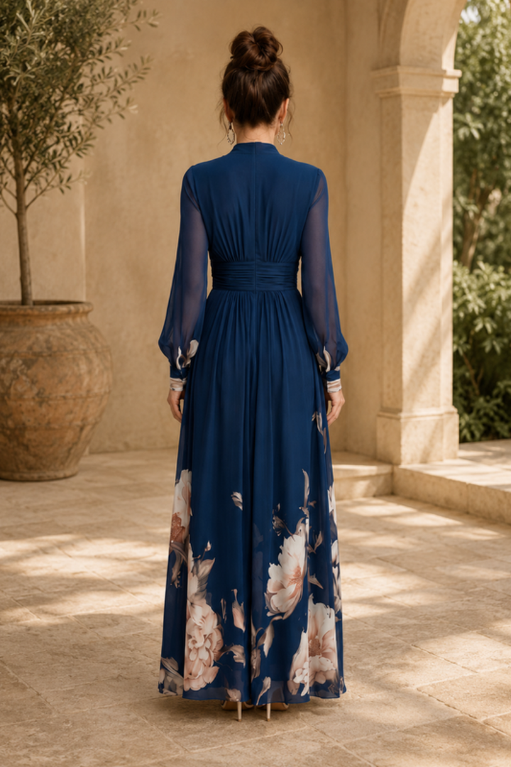 Long pleated evening gown for women, featuring elegant sheer sleeves. A sophisticated maxi dress for special occasions.