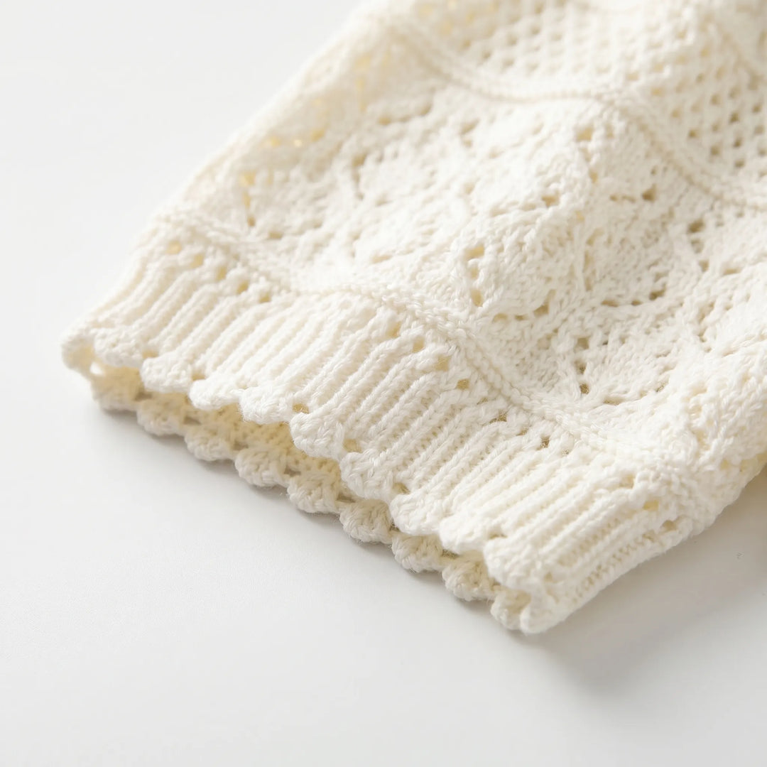 Stylish women's short-sleeve knit pullover blouse, a versatile elegant top for casual summer outfits.