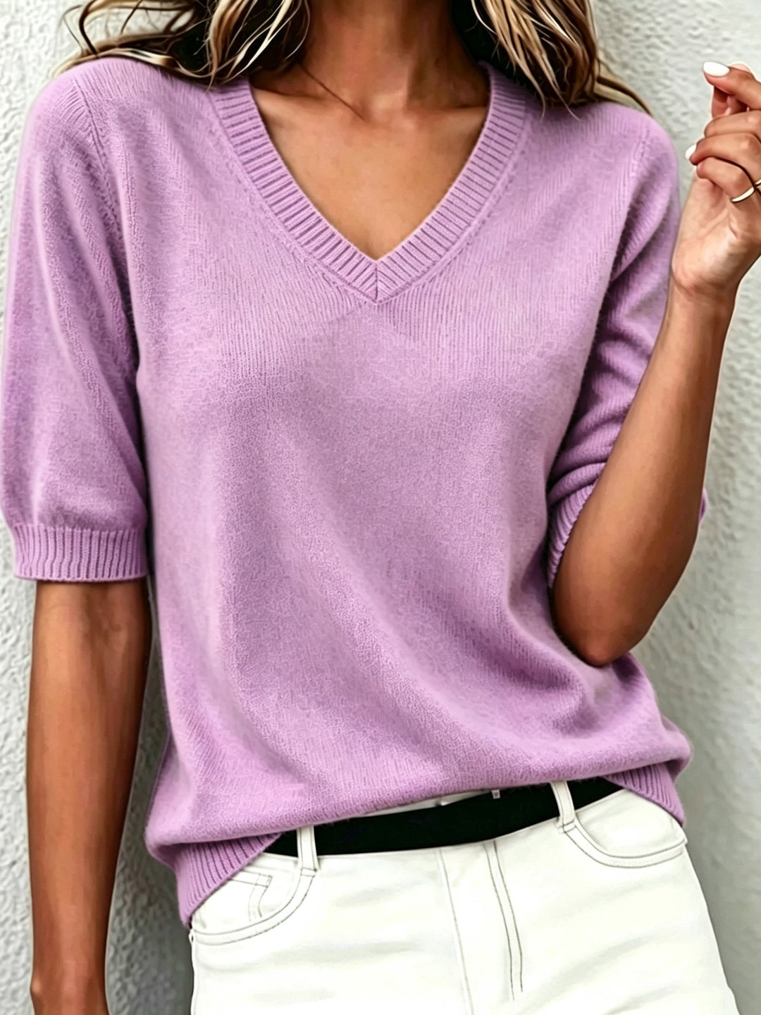 Elegant women's short-sleeve V-neck sweater with ribbed collar, perfect for versatile office wear or casual chic.