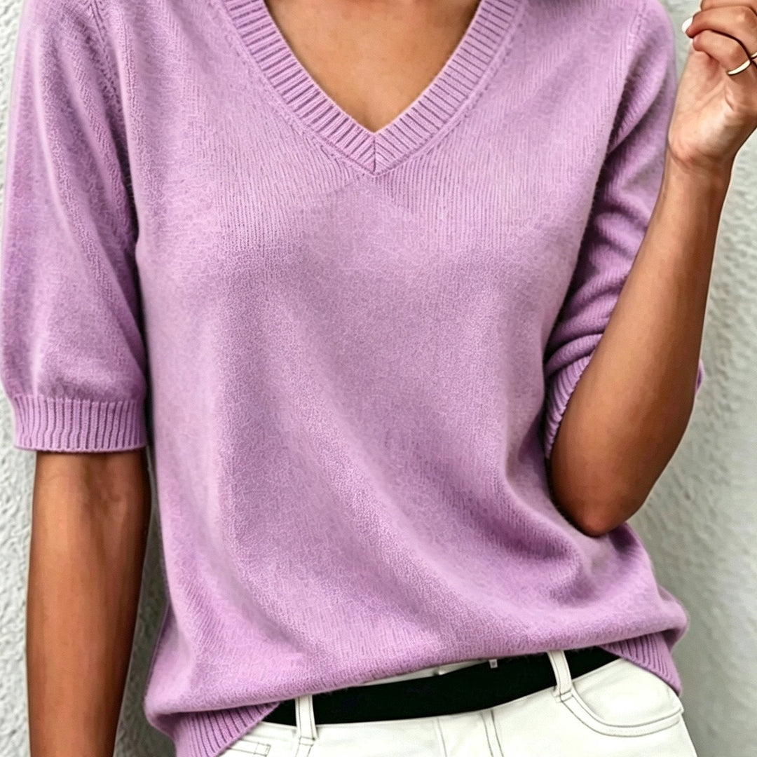 Soft women's short-sleeve V-neck top, an elegant choice for office wear or a comfortable, casual chic look.