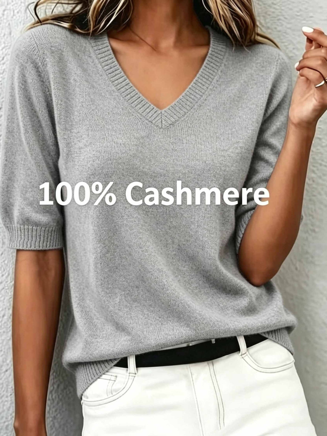 Versatile women's short-sleeve V-neck sweater with a distinctive ribbed collar, suitable for any elegant outfit.