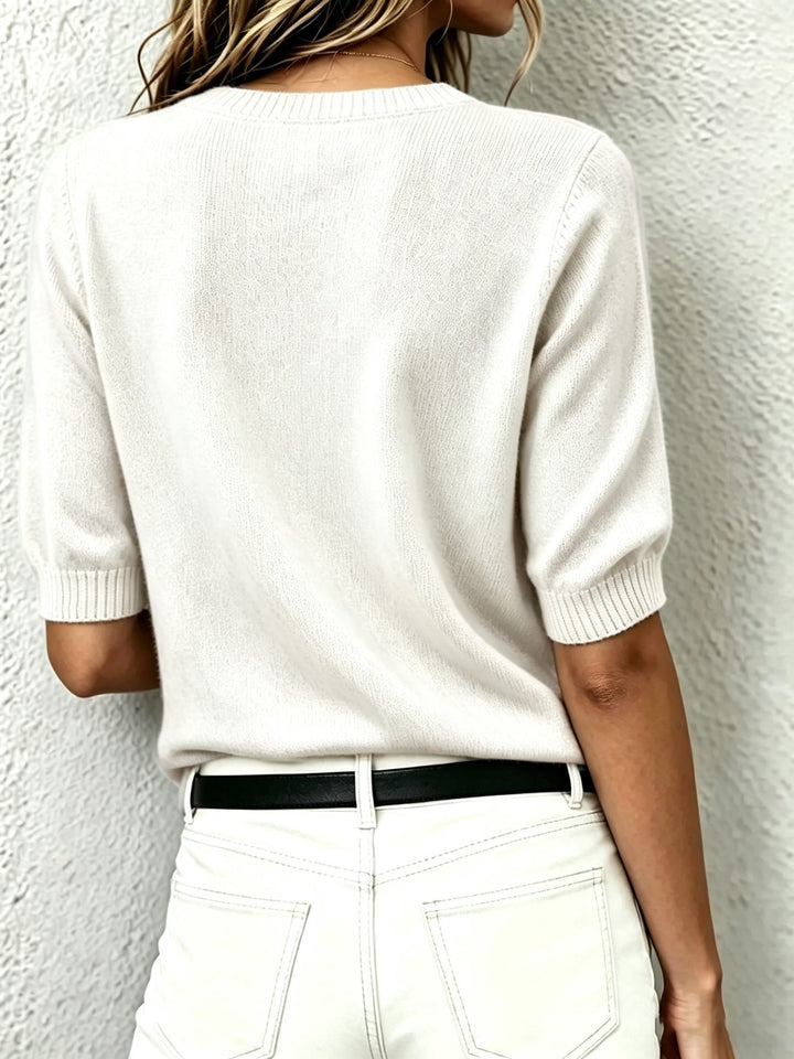 Casual chic or office wear: elegant women's short-sleeve V-neck sweater with a refined ribbed collar design.