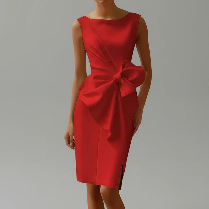 Stylish women's midi occasion wear dress with a prominent bow detail, suitable for evening events and formal gatherings.