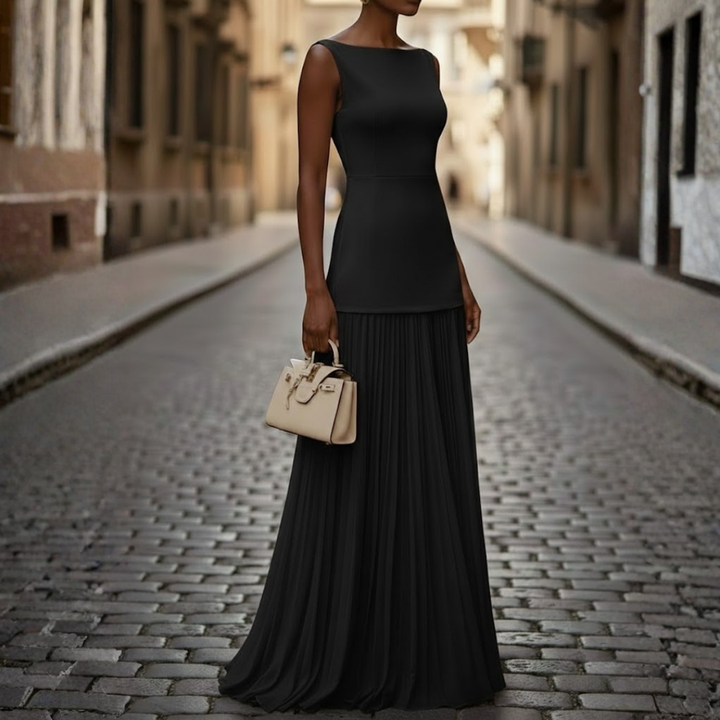 Women's formal sleeveless maxi dress with a stylish boat neck and flowing pleated skirt. Ideal for parties.