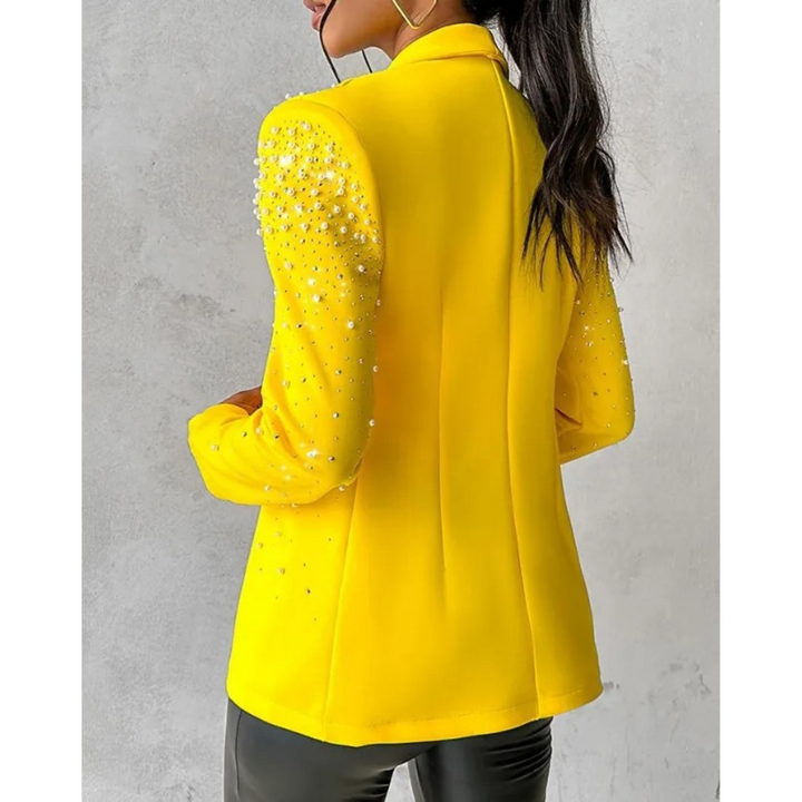 Modern women's slim blazer with elegant pearl details. A versatile jacket for professional office wear or a chic party outfit.