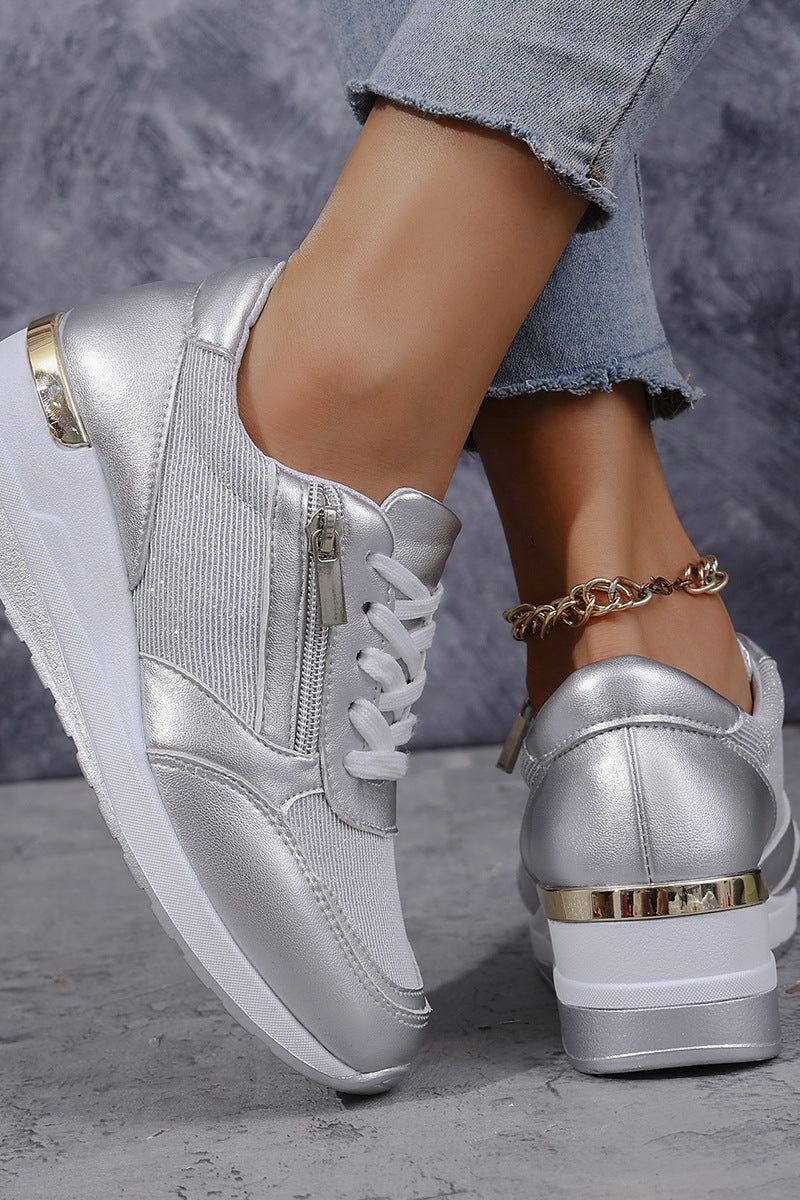 Stylish silver slip-on shoes for women, offering comfort & a sophisticated look for office wear.