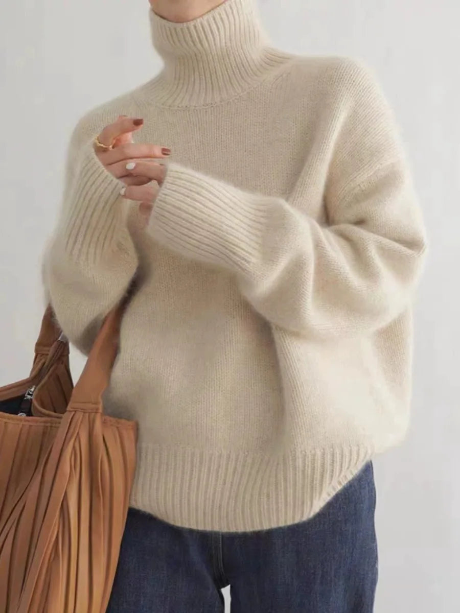 Elegant women's soft turtleneck sweater, ideal for fall/winter, cozy layering or casual wear.