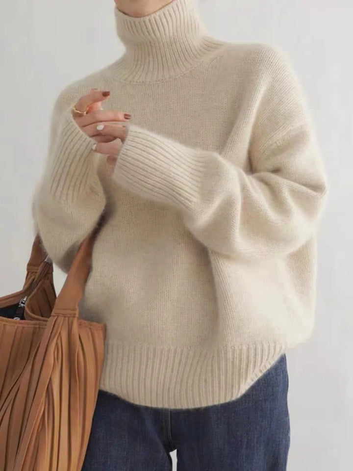 Elegant women's soft turtleneck sweater, ideal for fall/winter, cozy layering or casual wear.