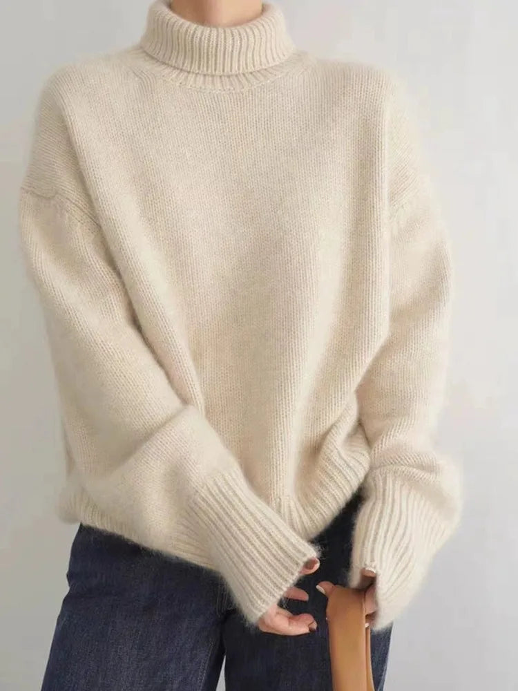 Cozy women's relaxed fit oversized turtleneck sweater in soft knit, perfect for loungewear or winter layering.