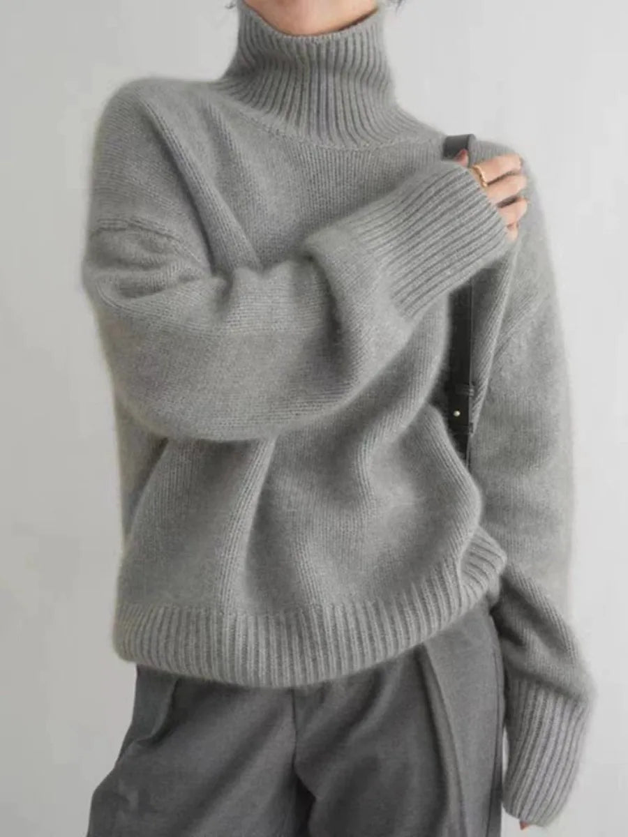 Luxurious soft knit women's turtleneck sweater. Elegant, warm, and cozy relaxed fit, perfect for winter layering.