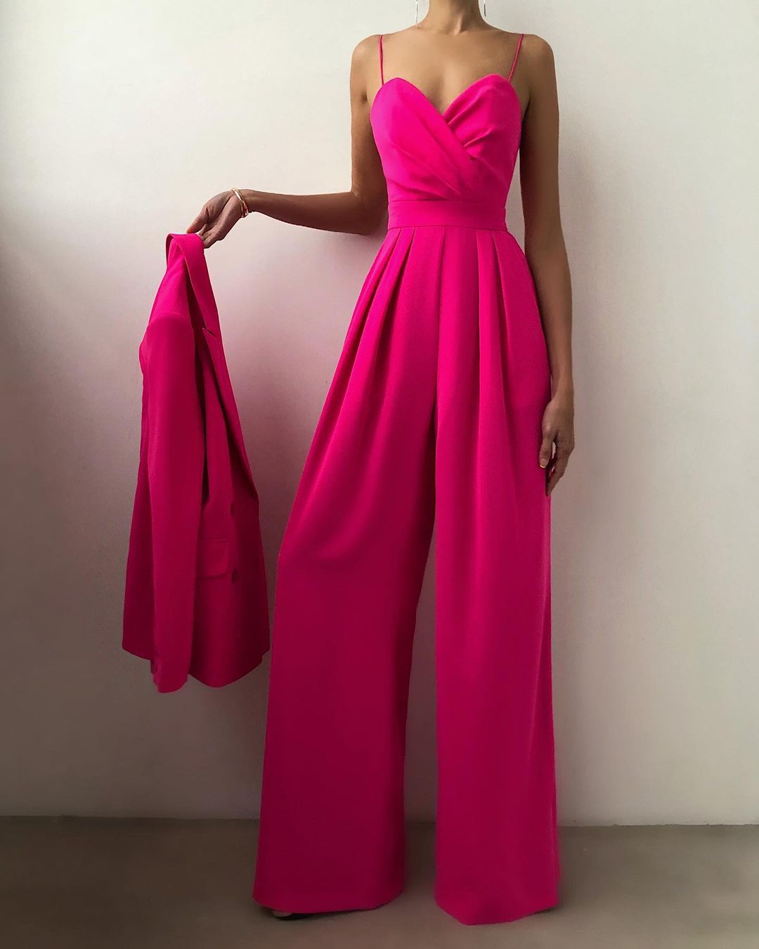 Women's formal wide-leg jumpsuit with delicate spaghetti straps, designed for elegant evening and party wear.