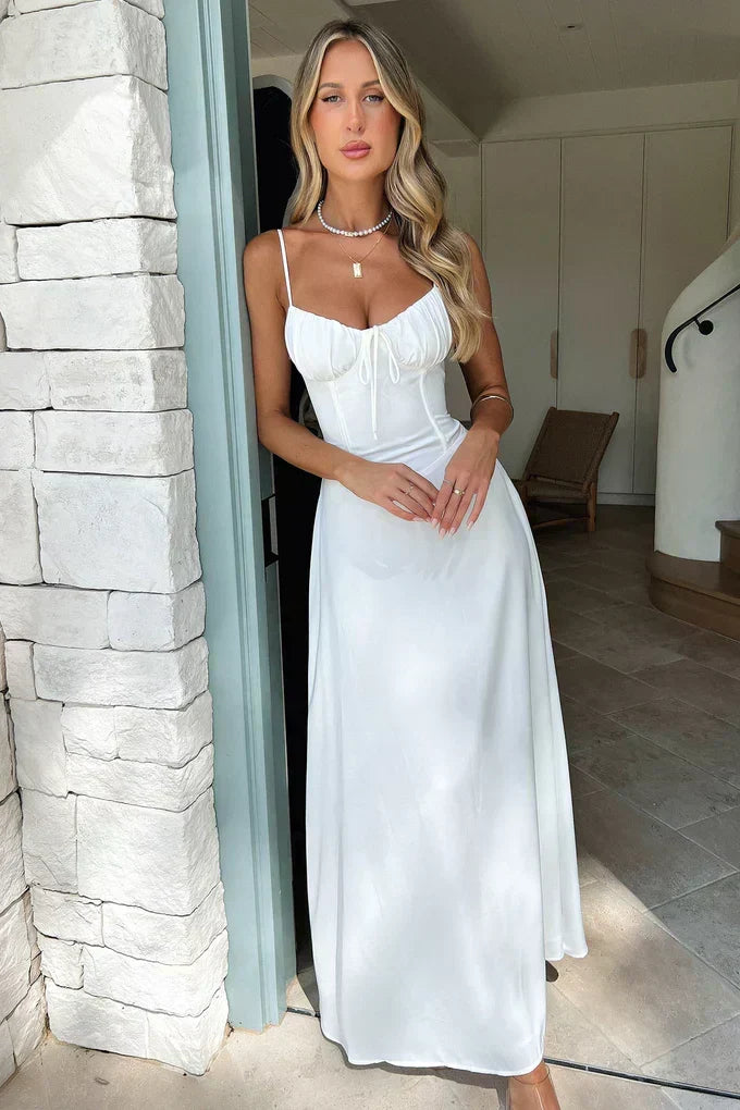Women's elegant spaghetti strap wrap maxi dress. A stunning yellow formal gown for wedding guests & summer events.