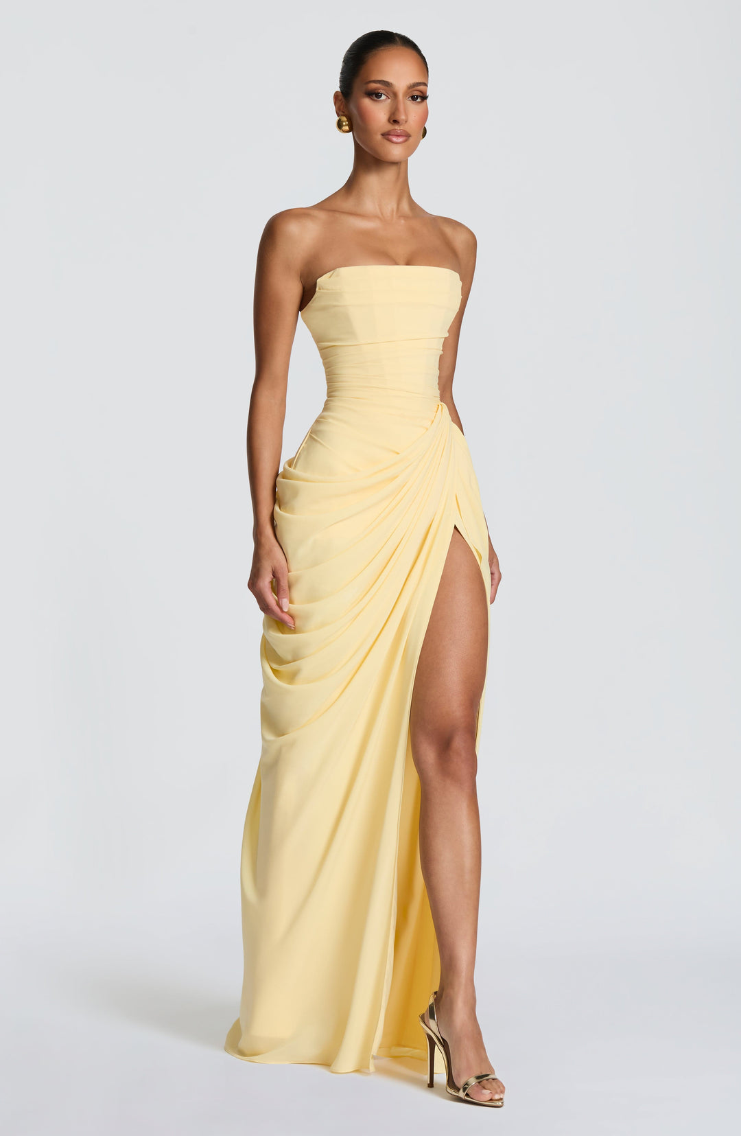 Beautiful yellow strapless maxi dress with corset bodice, ideal for parties & formal events.