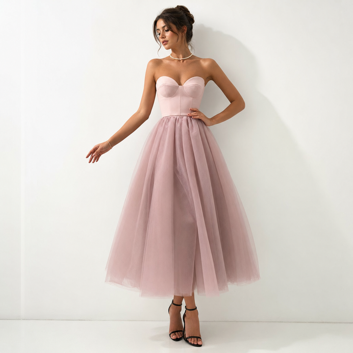 Women's formal wear: sophisticated strapless evening gown with flowing pleated skirt, ideal for special events.