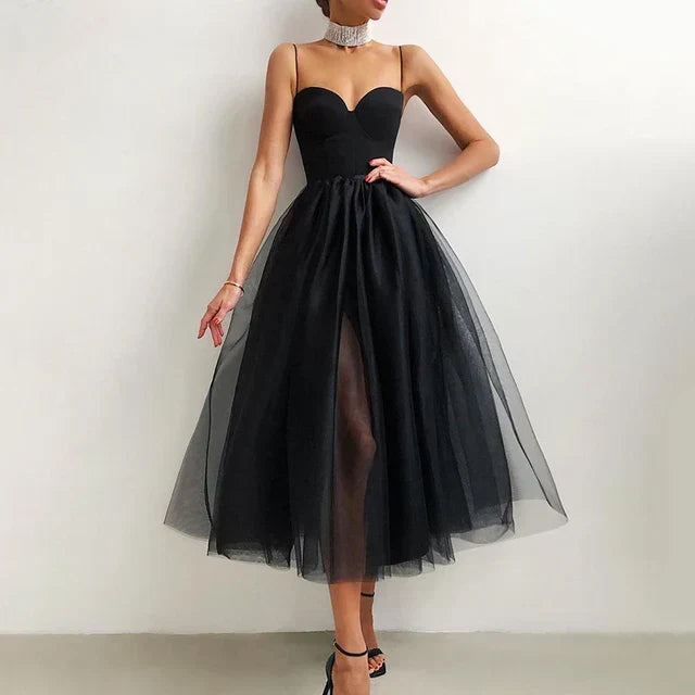 Glamorous strapless evening gown for women, featuring a flowing pleated skirt. Ideal for any special event.