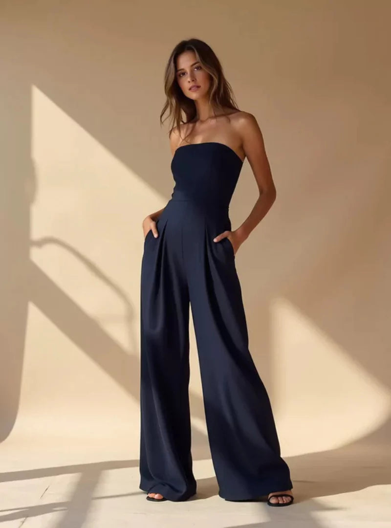 Sophisticated women's wide-leg strapless jumpsuit. A stylish evening or wedding guest outfit.