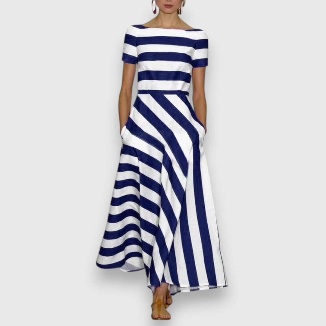 Elegant women's striped maxi dress with bateau neck, short sleeves, and practical pockets. Perfect for summer fashion.