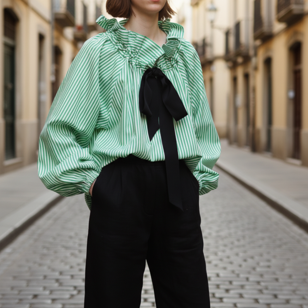 Elegant women's striped ruffle blouse with a chic bow tie, perfect for office or formal wear.