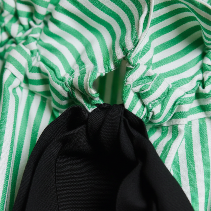 Office chic women's striped blouse with a ruffle neck & bow tie; an elegant top for professional settings.