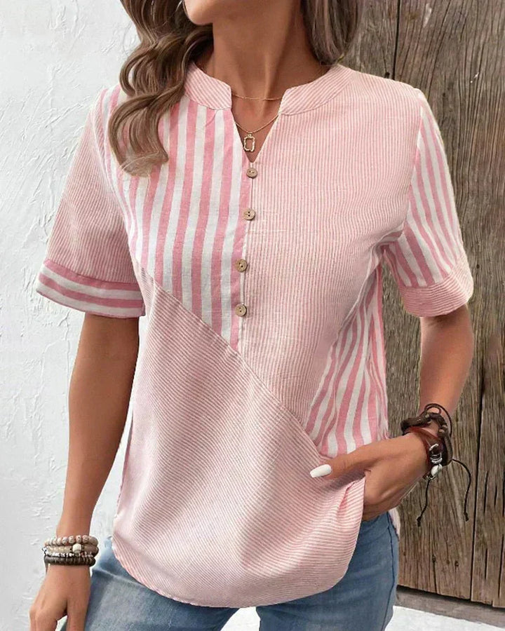 Elegant women's striped short sleeve blouse. Perfect for business casual or stylish everyday wear.