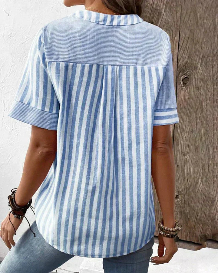 Fashionable women's short sleeve striped blouse, a versatile top for chic spring and summer outfits.