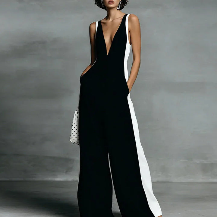 Stylish women's striped wide-leg jumpsuit with a V-neck, perfect for elegant vacation wear & brunch outfits.