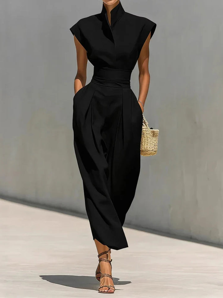 Chic women's structured midi dress with a flattering cinched waist and hidden pockets, ideal for modern office or evening.
