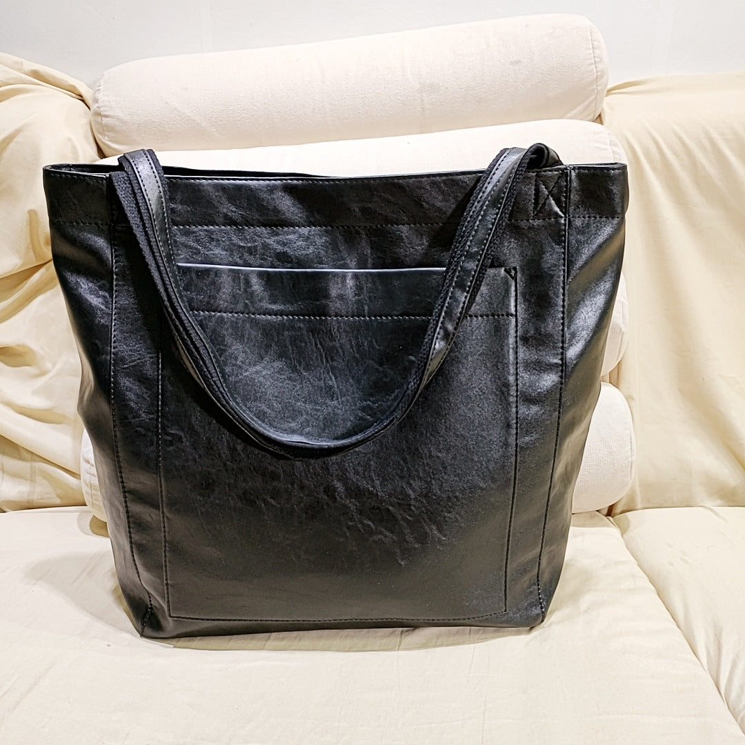 Modern women's structured tote bag, ideal as a work bag or elegant daily purse. Available in black, brown & dark brown.