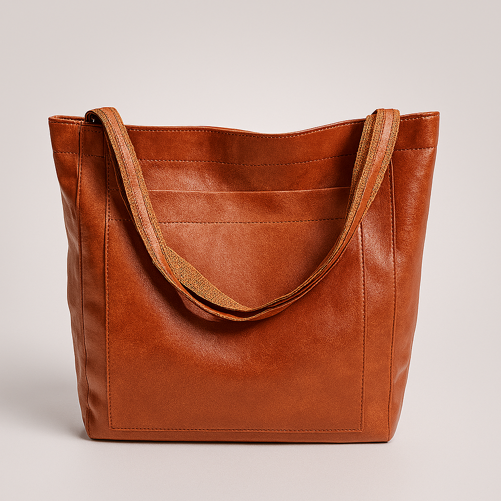 Elegant women's structured tote bag with exterior pocket. Ideal for work, daily use, or travel as a stylish handbag.