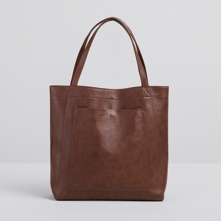 Sophisticated brown structured tote bag for women. Features a convenient exterior pocket, ideal for travel or daily fashion.