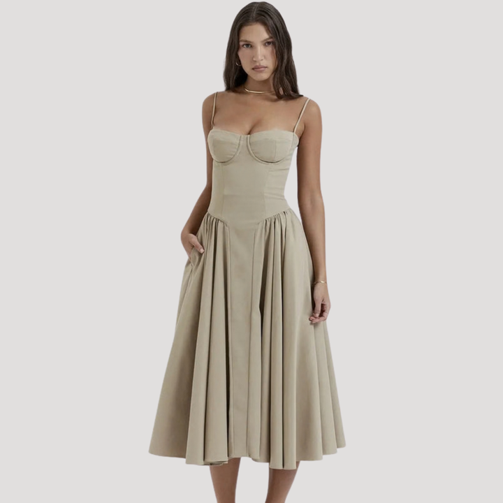 Women's elegant midi dress with a sweetheart neckline, corset bodice, delicate spaghetti straps, and full A-line skirt.