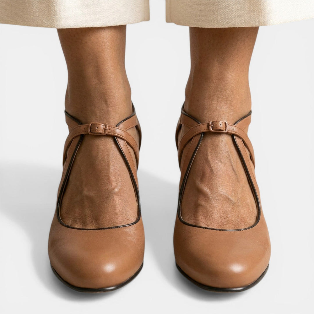 Stylish women's high heel T-Strap sandals, featuring a round toe and secure buckle closure.