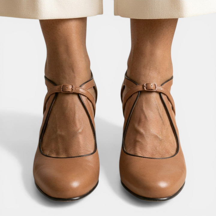 Stylish women's high heel T-Strap sandals, featuring a round toe and secure buckle closure.